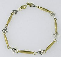 14k trinity knot and Ogham bar bracelet in white and yellow gold