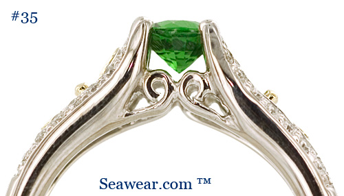emerald green gemstone Celtic engagement ring